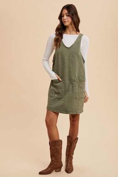 Stylish V-Neck Denim Dress with Adjustable Straps and Handy Pockets